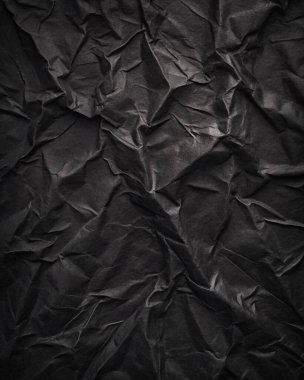 Buruşuk kağıt kırışıklıkları olan şık siyah doku, editör tasarımı için mükemmel, modern posterler, ve yaratıcı grafik projeleri.