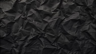Buruşuk kağıt kırışıklıkları olan şık siyah doku, editör tasarımı için mükemmel, modern posterler, ve yaratıcı grafik projeleri.