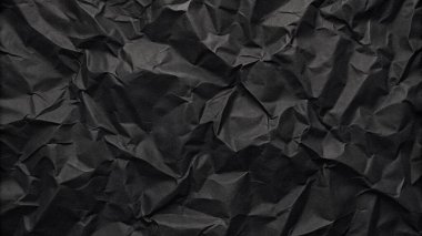 Buruşuk kağıt kırışıklıkları olan şık siyah doku, editör tasarımı için mükemmel, modern posterler, ve yaratıcı grafik projeleri.