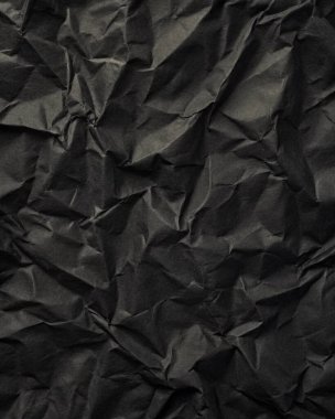 Buruşuk kağıt kırışıklıkları olan şık siyah doku, editör tasarımı için mükemmel, modern posterler, ve yaratıcı grafik projeleri.