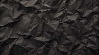 Buruşuk kağıt kırışıklıkları olan şık siyah doku, editör tasarımı için mükemmel, modern posterler, ve yaratıcı grafik projeleri.