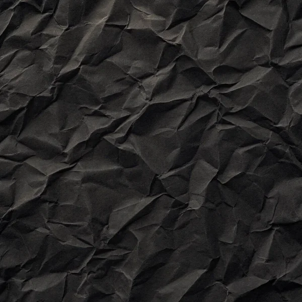 Buruşuk kağıt kırışıklıkları olan şık siyah doku, editör tasarımı için mükemmel, modern posterler, ve yaratıcı grafik projeleri.