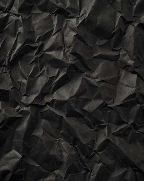 Buruşuk kağıt kırışıklıkları olan şık siyah doku, editör tasarımı için mükemmel, modern posterler, ve yaratıcı grafik projeleri.