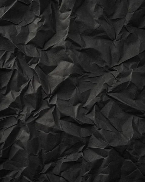 Buruşuk kağıt kırışıklıkları olan şık siyah doku, editör tasarımı için mükemmel, modern posterler, ve yaratıcı grafik projeleri.