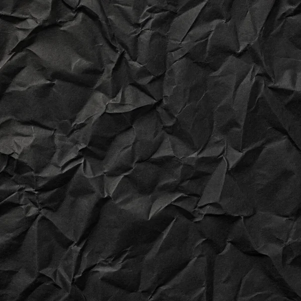 Buruşuk kağıt kırışıklıkları olan şık siyah doku, editör tasarımı için mükemmel, modern posterler, ve yaratıcı grafik projeleri.