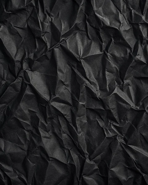 Buruşuk kağıt kırışıklıkları olan şık siyah doku, editör tasarımı için mükemmel, modern posterler, ve yaratıcı grafik projeleri.
