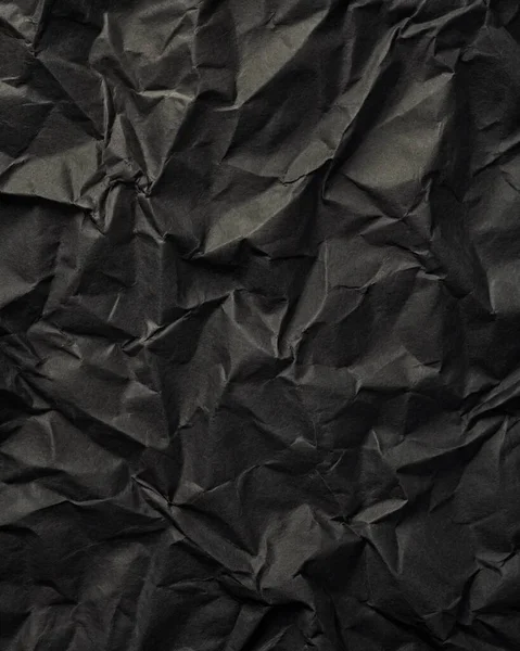 Buruşuk kağıt kırışıklıkları olan şık siyah doku, editör tasarımı için mükemmel, modern posterler, ve yaratıcı grafik projeleri.