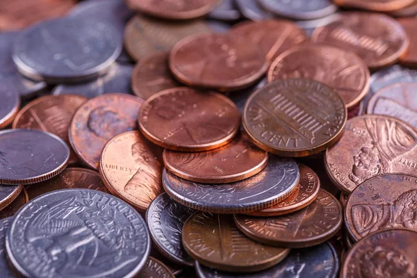 Pile of Golden coin, silver coin, copper coin, quarters, nickels