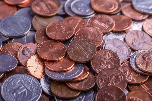 Pile of Golden coin, silver coin, copper coin, quarters, nickels