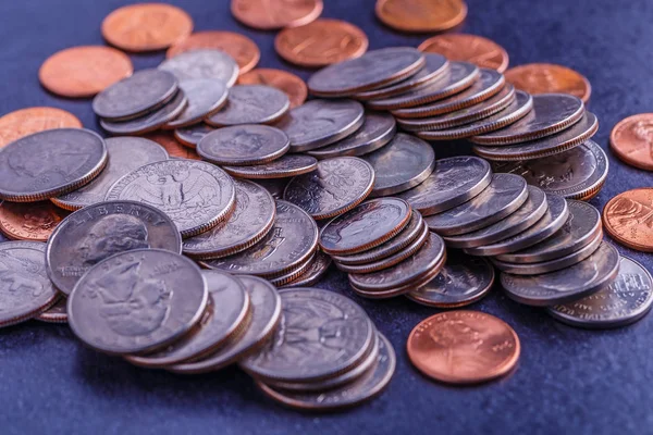 Pile of Golden coin, silver coin, copper coin, quarters, nickels