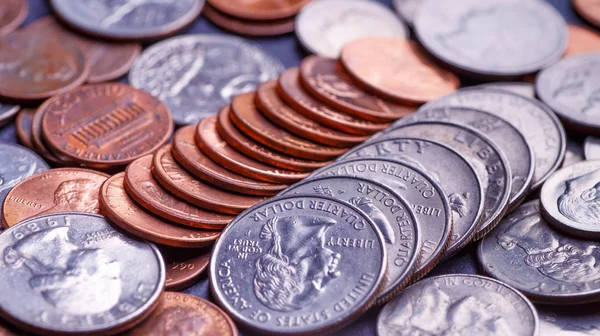 Pile of Golden coin, silver coin, copper coin, quarters, nickels