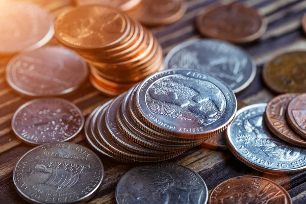 Pile of Golden coin, silver coin, copper coin, quarters, nickels