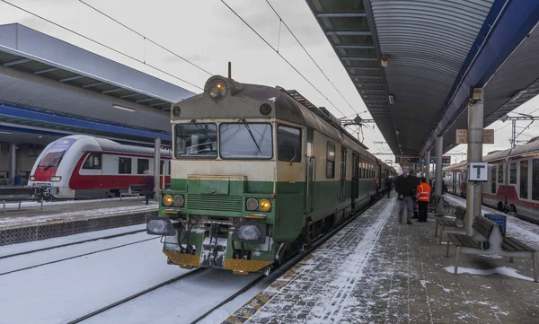 Presov station in winter snow cloudy morning with trains and platforms