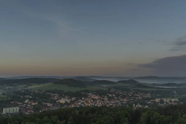 View from Jehla hill over Ceska Kamenice town in spring misty morning — Stock Photo, Image