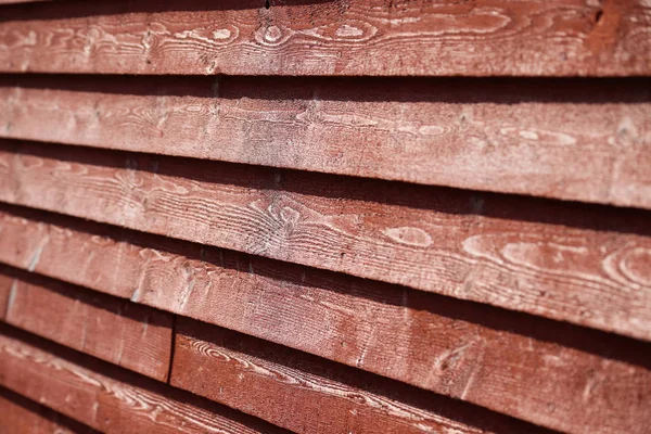 Red wood siding on an old barn building