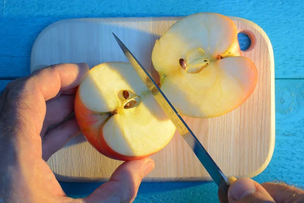 Cutting Apple His Hand Knife Cutting Wooden Cutting Board Turquoise — Stock Photo, Image