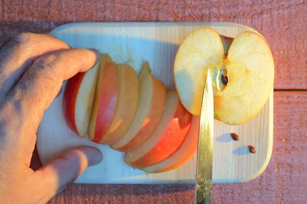 Cutting Apple His Hand Knife Cutting Wooden Cutting Board Red — Stock Photo, Image