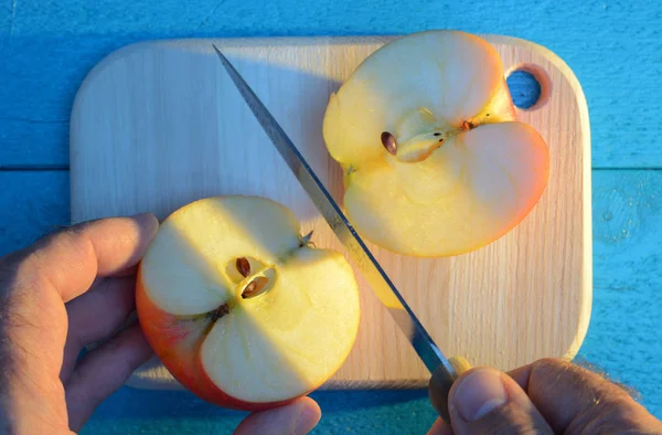 Cutting Apple His Hand Knife Cutting Wooden Cutting Board Turquoise — Stock Photo, Image