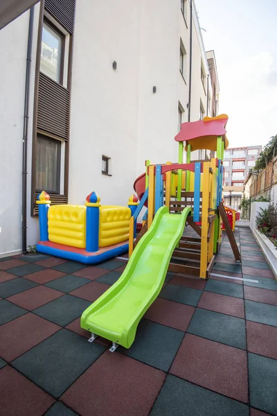 Playground kid zone in a hotel rest territory. Modern children playground, Children playground on yard activities in park