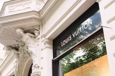 Prague, Czech Republic - May 23, 2018: Logo Louis Vuitton. Prague boutique in Rue de Paris clipart