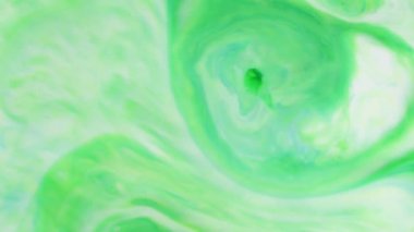 Soyut Renkli Boya Mürekkebi Patlaması Psikedelik Patlama Hareketi. yumuşak renkler, soyut kompozisyon. Yeşil mermer zemin ile akrilik dokusu 