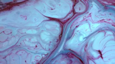 Soyut Renkli Boya Mürekkebi Patlaması Psikedelik Patlama Hareketi. yumuşak renkler, soyut kompozisyon. Mavi mermer zemin ile akrilik dokusu 