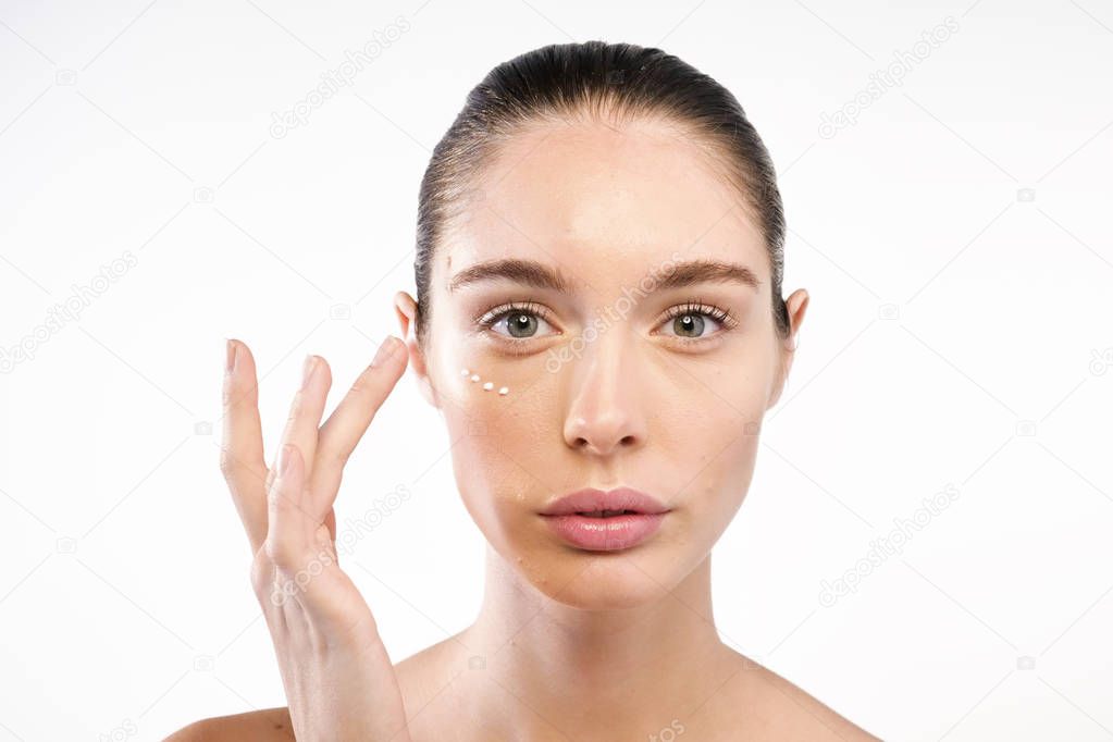 woman with anti-wrinkles cream for face 