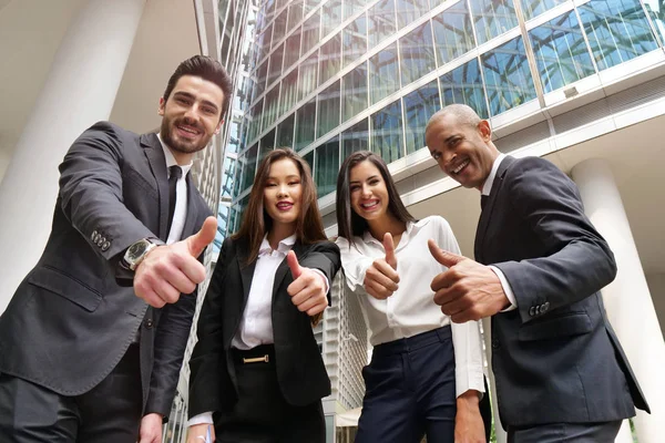 Business people of different ethnicities dressed in suits and ties, smile and \