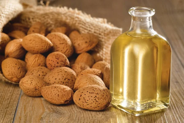 Almond oil composition used for cosmetics, spa, wellness centers. Perfect body oil and moisturizing skin. Concept of: beauty, oils, creams, wellness.
