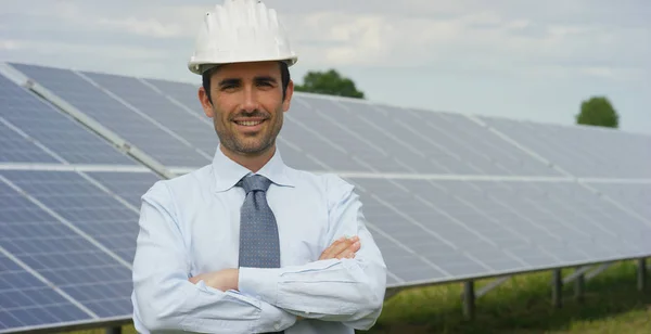 Caucasian Man Helmet Standing Eco Solar Panels Arms Crossed Looking — Stock Photo, Image
