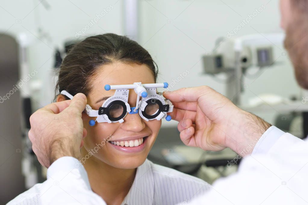 checking eyes with testing device, Calibrating eye test glasses phoropter
