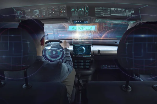 in a futuristic world a person drives a car of the future with holographic technology and augmented reality, concept of transportation and immersive technology linked to travel,  cars with Autopilot