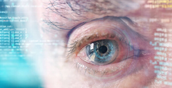 Macro shot of elderly eye with holographic digital scanning identification