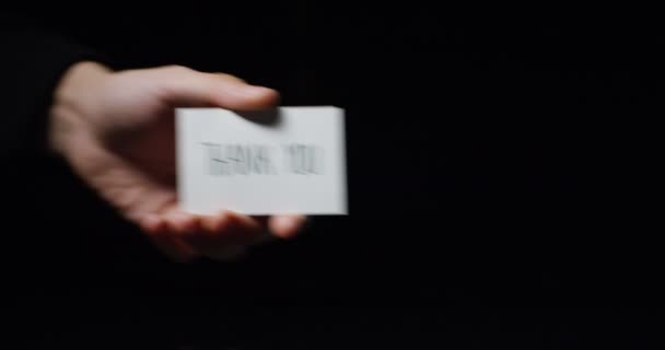 Video Partial View Hand Showing Small Paper Card Message Thank — Stock Video