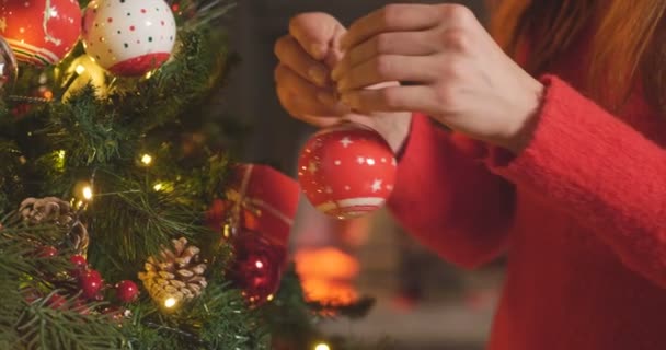 Video Woman Celebrating New Year Home Christmas Tree Hanging Toy — Stock Video