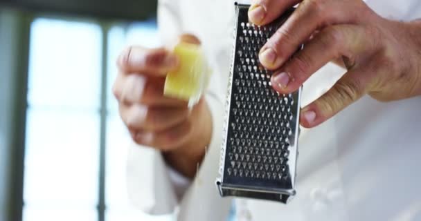 Slow Motion Video Chef Grating Parmesan Cheese Grater — Stock Video