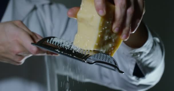 Slow Motion Video Man Grating Parmesan Cheese — Stock Video