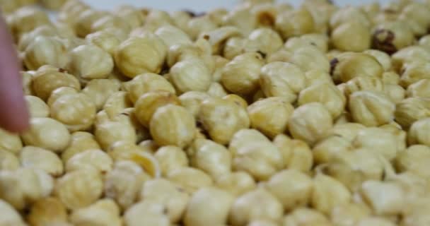 Close Man Touching Peeled Light Yellow Hazelnuts Concept Salted Nuts — Stock Video