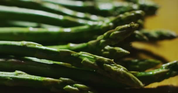 Macro Close Slider Fresh Juicy Asparagus Wooden Kitchen Table — Stock Video