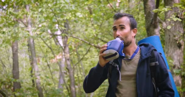 Video Hiker Traveler Man Forest Drinking Water Bottle — Stock Video