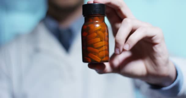 Video Man Doctor Wearing White Coat Showing Bottle Pills — Stock Video