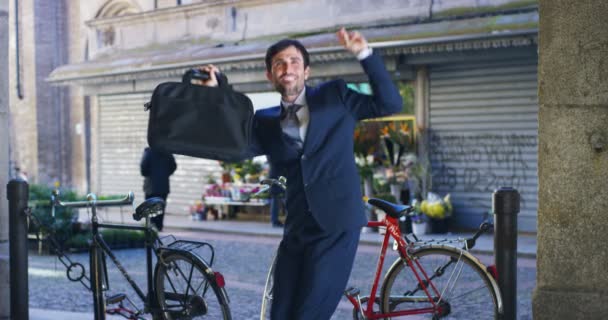 Video Happy Caucasian Businessman Dancing Celebrating Success Outdoors Holding Case — Stock Video