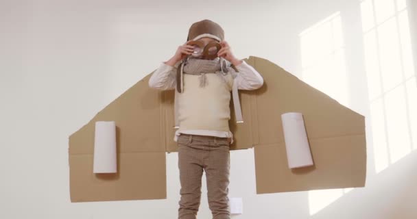 Little Boy Dressed Pilot Playing Handmade Cardboard Box Plane Slow — Stock Video