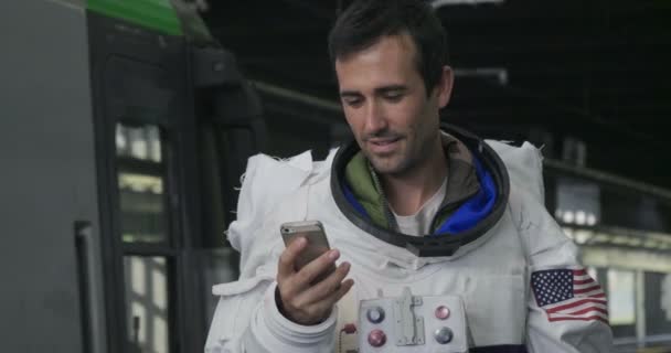 Astronaut Dressed Man Uses Smartphone Call Send Messages Astronaut Smiles — Stock Video