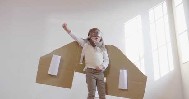 Little Boy Dressed Pilot Playing Handmade Cardboard Box Plane Slow — Stock Video