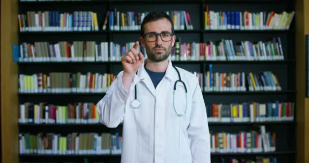 Young Beautiful Doctor Library Smiling Happy Holding Books Doing Search — Stock Video