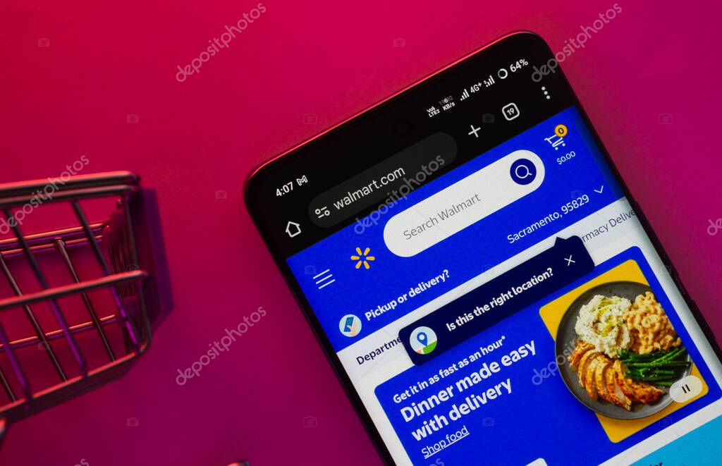 Dhaka, Bangladesh- 23 June 2025: A smartphone displaying the Walmart website with a shopping cart is shown on a vibrant background.