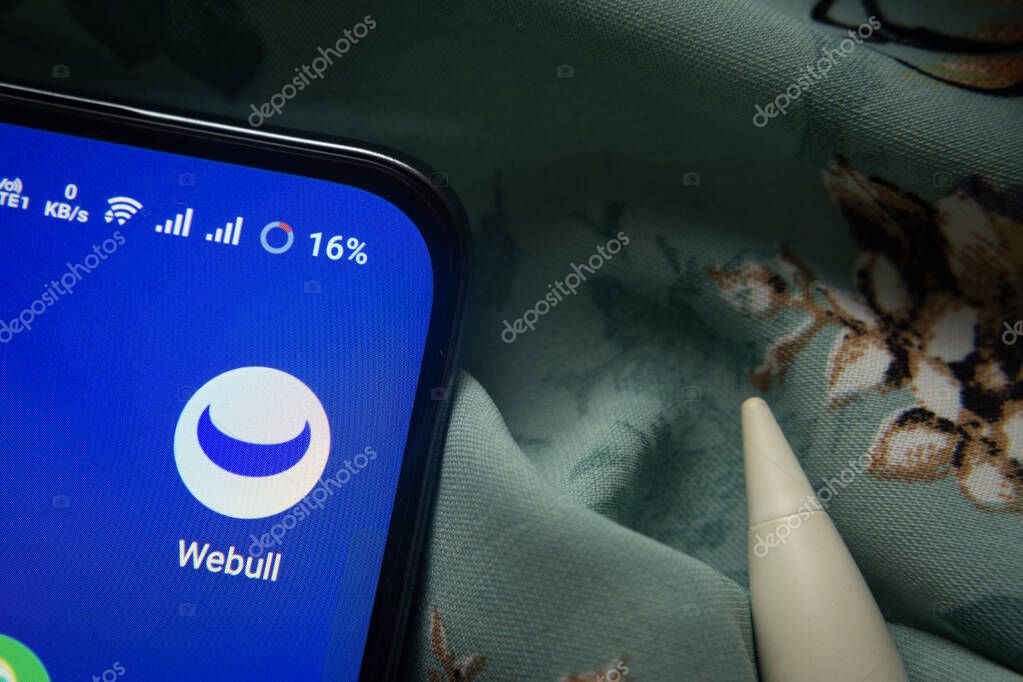Dhaka, Bangladesh- 07 May 2025: webull app icon is seen on smartphone.