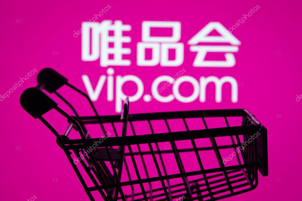Dhaka, Bangladesh- 03 July 2025: Silhouette of a shopping cart in front of the Vip.com logo, symbolizing ecommerce and online shopping