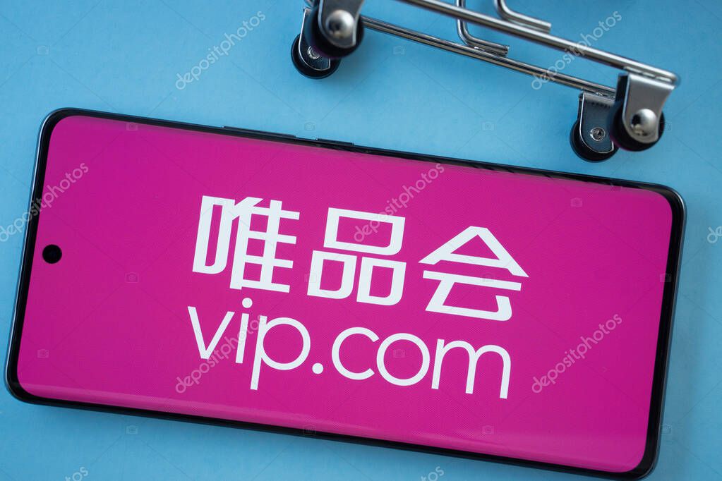 Dhaka, Bangladesh- 03 July 2025: Smartphone screen showing the vip.com logo with shopping cart wheels on a blue background.